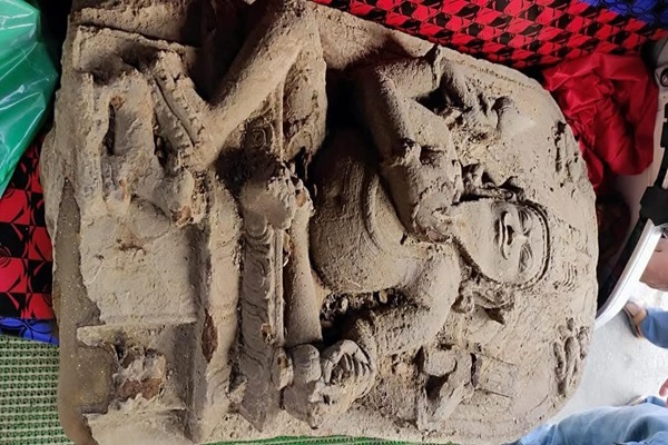 Large stone statue discover while working on a village road project