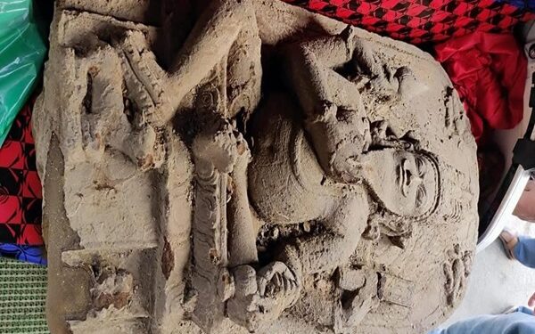 Large stone statue discover while working on a village road project