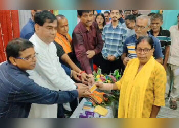 Agartala Mayor Dipak Majumder hands out smart PVC ration cards