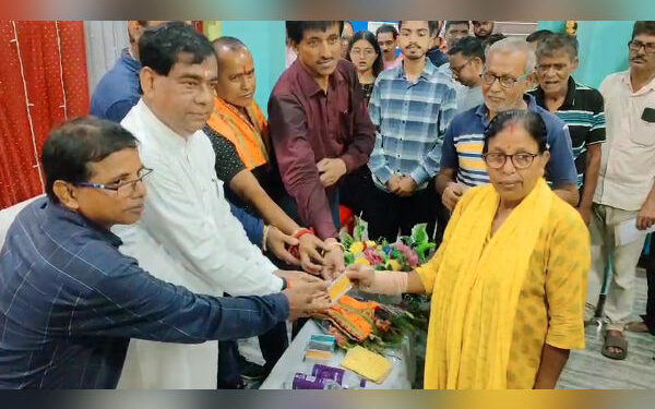 Agartala Mayor Dipak Majumder hands out smart PVC ration cards